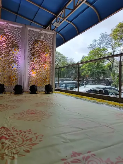 The guest experience starts from the entrance. Here, I've decorated the passage area with ornate backlit panels, setting a grand tone for the event before guests even reach the main hall.