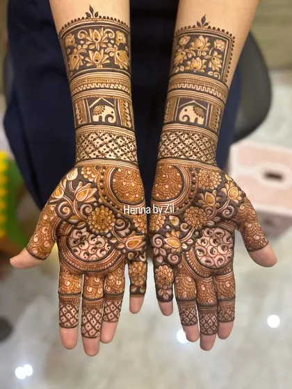 A bold and beautiful design combining floral mandalas on the palms with bands of elephants and flowers on the arms.