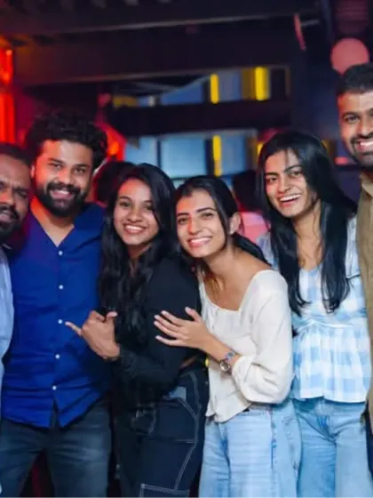 A group of friends having a great time at one of my Sunday gigs. My music brings people together.