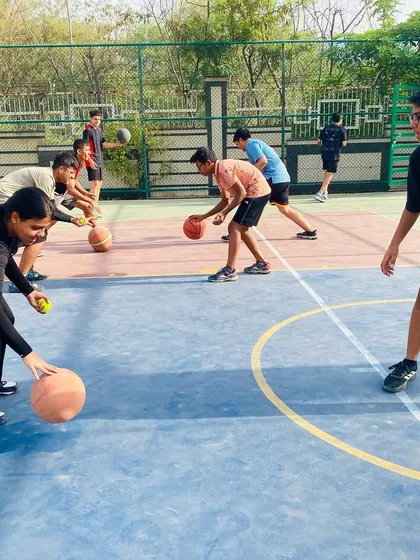 We get hands-on with our coaching. Here, I'm guiding players through a two-ball dribbling drill to improve their coordination and ability to handle the ball under pressure.