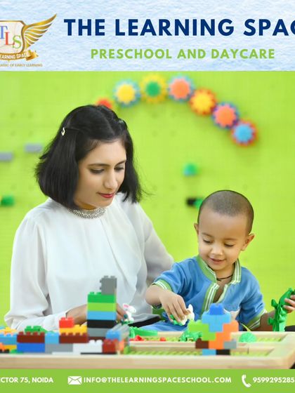 A child and teacher build together in our Lego Space. This interactive area fosters collaboration and problem-solving, guided by our supportive educators.