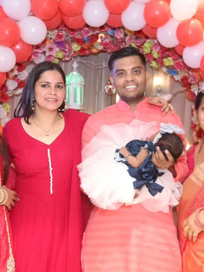 A lovely family portrait with the newborn baby at the center of all the love and attention. Perfect for framing and remembering this special day.