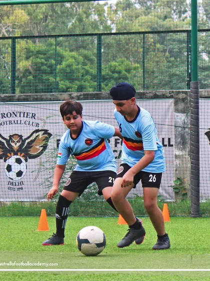 Players navigate a cone drill, focusing on maintaining close control of the ball while changing direction.