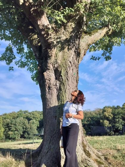 Connecting with the wisdom of an ancient tree in Cologne, Germany. Nature's teachings are universal, and we find our practice wherever we go.