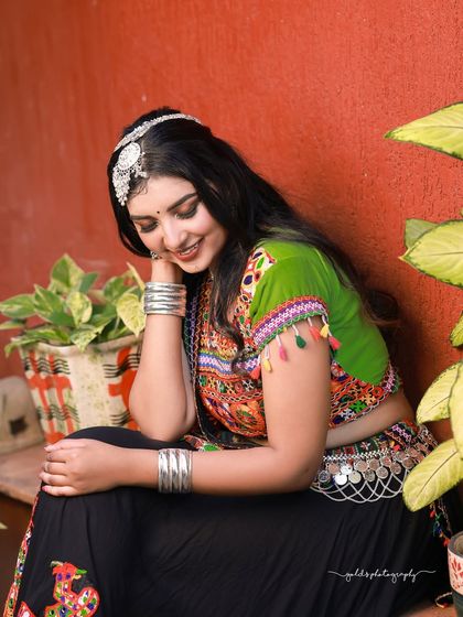 A vibrant and energetic series celebrating Navratri. The model is dressed in colorful Garba attire, and the photos capture the festive spirit through dynamic poses and joyful expressions.