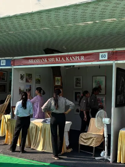 A collection of photos from various art exhibitions and fairs I've participated in, including the National Exhibition of Art and the Jaipur Kala Mela. It's an honor to have my work displayed in these prestigious venues.