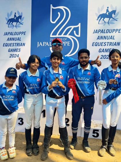 Our riders and coach on the podium at Japalouppe. We train our kids to do their best, and seeing them succeed is the ultimate reward.