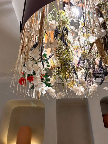 The decor at La Croûte is as beautiful as their food. I captured this shot of their floral chandelier to set the scene and convey the charming, whimsical atmosphere of the cafe.