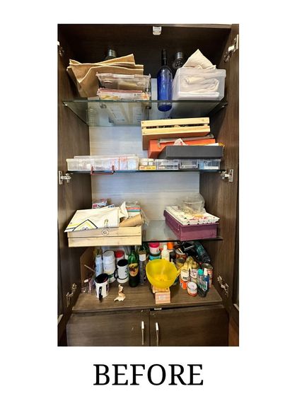 Before: A cabinet for art supplies, cluttered with paints, boxes, and tools, making it difficult for the artist to find what she needed.