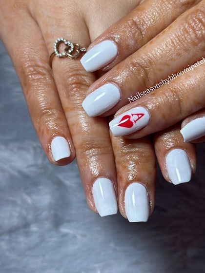 A playful and bold design, perfect for a fun event. Crisp white nails with a single accent nail featuring the ace of hearts.
