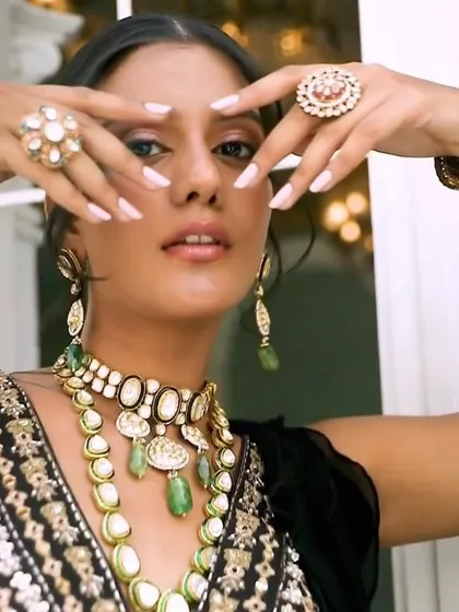 Another angle of this stunning polki set, showing how the pieces catch the light. The combination of a black saree with this kind of statement jewellery is a timeless choice for any formal occasion.