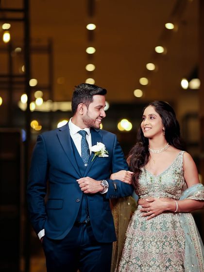A classic shot of the couple. Her makeup is flawless and her smile is radiant, making for a perfect wedding photo.