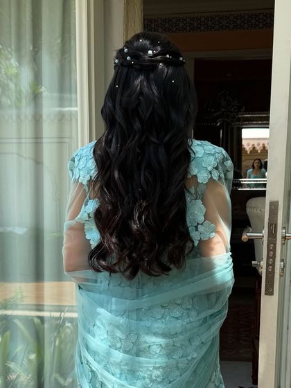 The hairstyle seen from a distance, perfect for a relaxed and elegant daytime event.