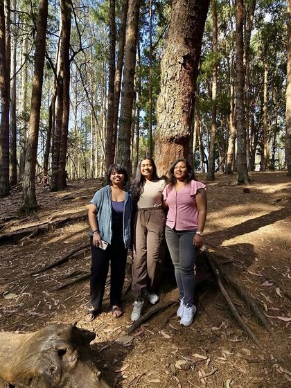 Three friends enjoying the serene atmosphere of the Kodaikanal forest. Many people come solo and leave with friends for life.