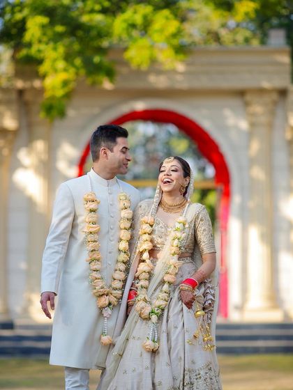 The laughter and joy of a newly married couple. This candid shot captures the lighthearted and happy connection between them right after their day wedding ceremony.