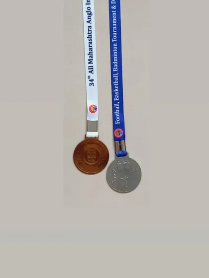 A close-up of the silver and bronze medals won by Avni Arlekar in Pune, representing her success in both U17 and U19 categories.