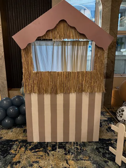 A puppet show booth, ready to entertain the children with fun stories and characters at the farm-themed birthday.