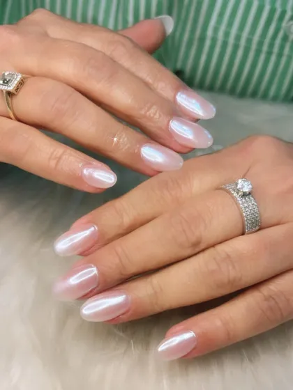 A beautiful example of white pearl chrome nails. This "glazed donut" look, popularized by Hailey Bieber, is one of my most requested styles for its subtle, elegant shimmer.