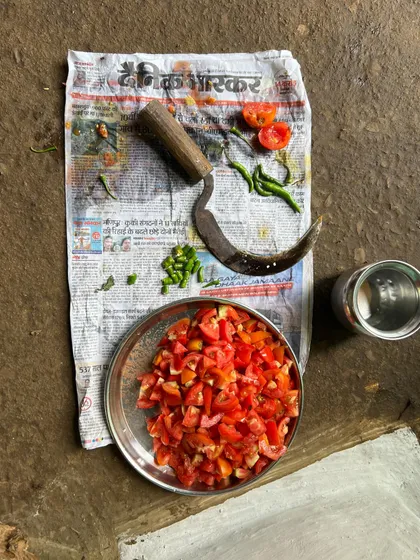The simple, fresh ingredients for a traditional tomato chutney, prepared with a local sickle-shaped knife. We love learning and sharing these authentic recipes from the villages we visit.