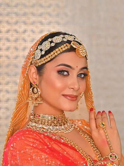 A moment of pure, simple beauty. This bride's look is all about grace, with soft eye makeup, a traditional sheeshpatti, and a radiant smile.