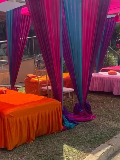 Comfortable and colorful seating is essential for a Mehendi party. I use low divans with bright covers to create a relaxed and traditional seating arrangement for guests.