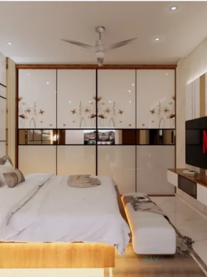 Another view of the luxurious bedroom, showing the TV unit integrated into the wall opposite the bed.