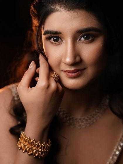 A close-up portrait, showing the subtle shimmer on the eyes and the flawless skin finish.