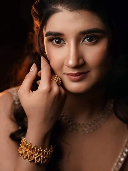 A close-up portrait, showing the subtle shimmer on the eyes and the flawless skin finish.