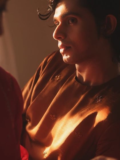 The interplay of light and shadow was crucial for this campaign's mood. It highlights the model's expression and the delicate embroidery on his kurta.