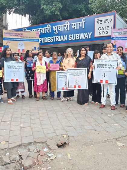 Standing with volunteers and students at a pedestrian subway entrance in Mumbai. We took our message to high-traffic public spaces to reach as many people as possible.