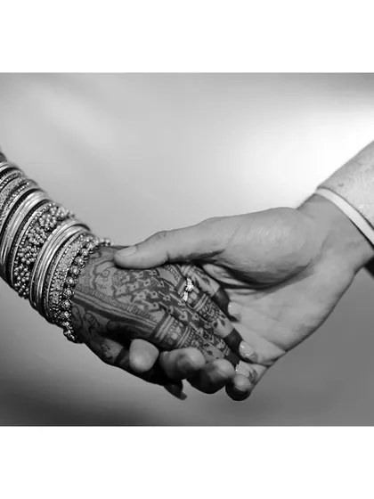 A timeless moment captured. This artistic black and white shot highlights how bridal mehendi becomes a part of your most cherished wedding memories.