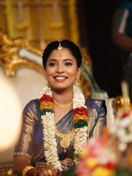 This candid shot captures the bride's genuine happiness. My goal is to create a look that allows the bride's personality to shine through.