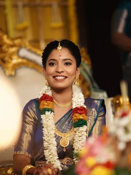 This candid shot captures the bride's genuine happiness. My goal is to create a look that allows the bride's personality to shine through.