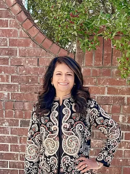 This client looks absolutely radiant in one of my embroidered jackets. The intricate paisley design is a statement in itself, and she wears it with such grace and confidence.
