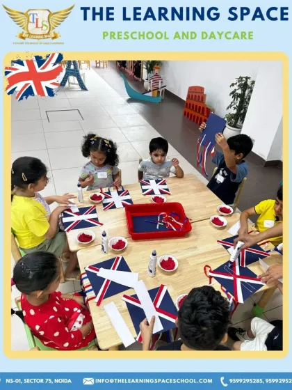 A table full of little artists, all focused on crafting their own Union Jack flags. This group activity encourages collaboration and shared learning as they explore the colors and patterns of the British flag.