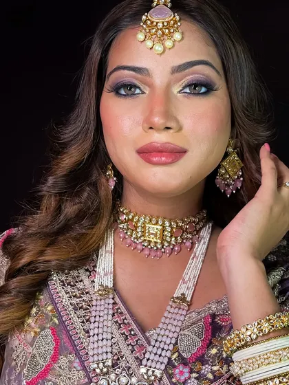 The complete look, showcasing the elegant hairstyle and how it complements the makeup.