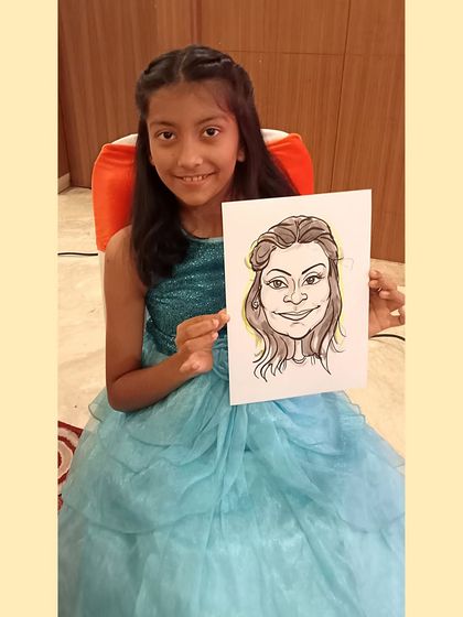 This young lady in a beautiful blue dress now has a unique portrait to remember the party by.