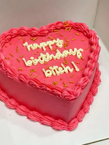 A fun, Gen-Z inspired heart-shaped curse cake. A playful and trendy way to wish your bestie a happy birthday.
