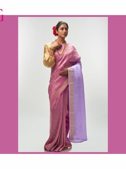 Another look at the pink and lavender saree, highlighting its soft color palette and luxurious texture.