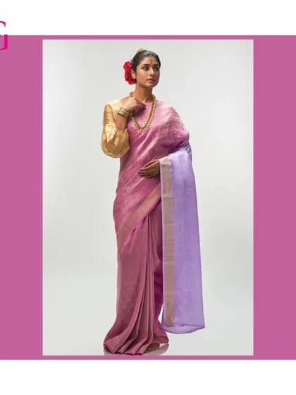 Another look at the pink and lavender saree, highlighting its soft color palette and luxurious texture.
