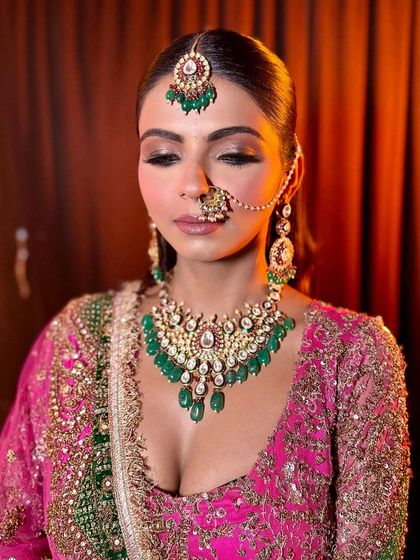 A close-up showing the details of the eye makeup and jewelry. The soft glam eye makeup enhances her features without overpowering the intricate outfit.