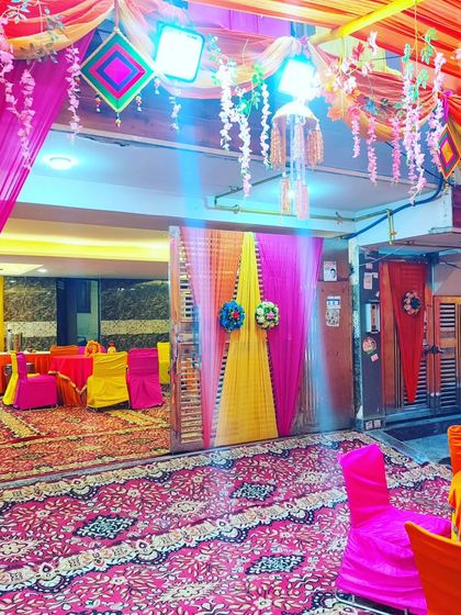 The entrance to an indoor hall from an outdoor tent, showing how I connect different spaces with cohesive decoration.