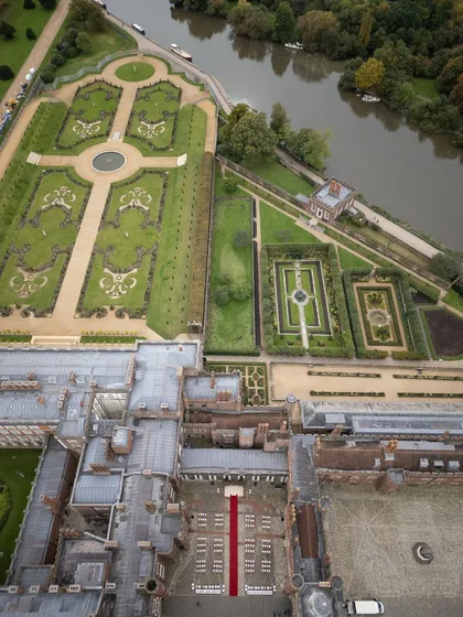 An aerial view of the historic Hampton Court Palace, where we set the stage for a royal Indian wedding in the English countryside. Our expertise in international wedding logistics allows us to transform iconic global venues into deeply personal celebrations.