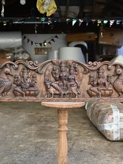 This 42-inch horizontal panel is a family portrait of the gods, featuring Lord Mahadev with Devi Parvathi, Goddess Lakshmi, and Lord Ganesh. It is a unique and auspicious composition for a family home.