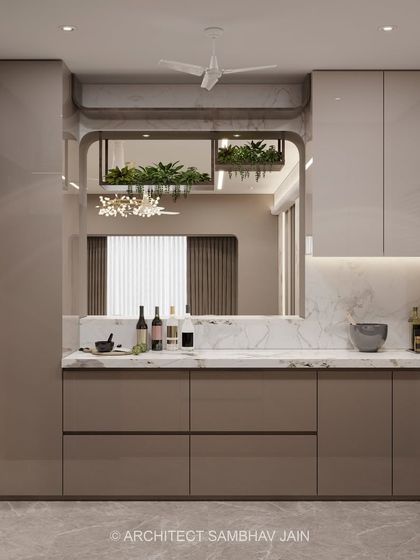 This beige-toned minimalist kitchen embodies quiet luxury and functional elegance. Soft matte cabinetry in warm beige hues creates a seamless and calming canvas, while the backsplash, clad in pristine white marble, adds a timeless and upscale dimension.
