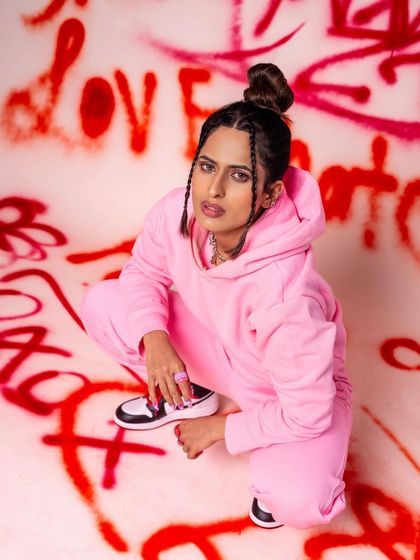 A crouching pose against the graffiti wall, giving off a cool, street-style vibe. This shows how models can interact with the set to create dynamic and engaging images.