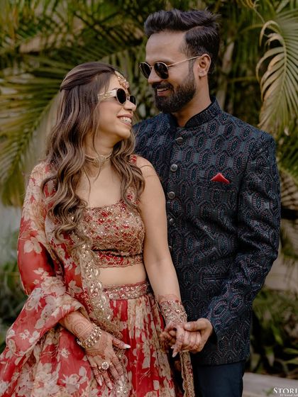 A fun and stylish pre-wedding shot of the couple in sunglasses, capturing their modern and cool personalities.