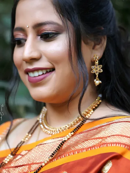 A beautiful candid shot of a client, showcasing a soft and natural makeup look that's perfect for any special occasion.