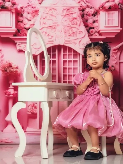 Little miss glamour. This toddler is enjoying her moment in the spotlight in our pink princess room.