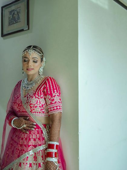 A quiet, elegant portrait of the bride. Her calm expression and beautiful diamond jewelry are the focus of this graceful shot.
